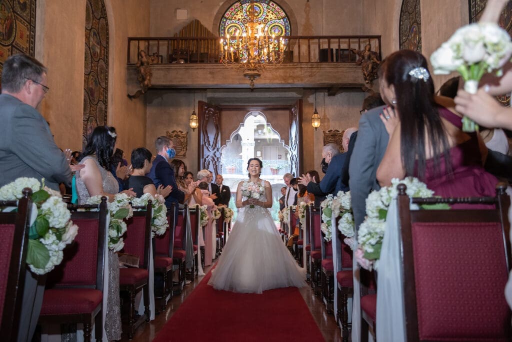 Amila and Kelly ceremony inside St. Francis Chapel at Mission Inn Hotel